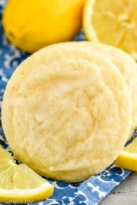 Close up photo of Lemon Sugar Cookies next to lemons.