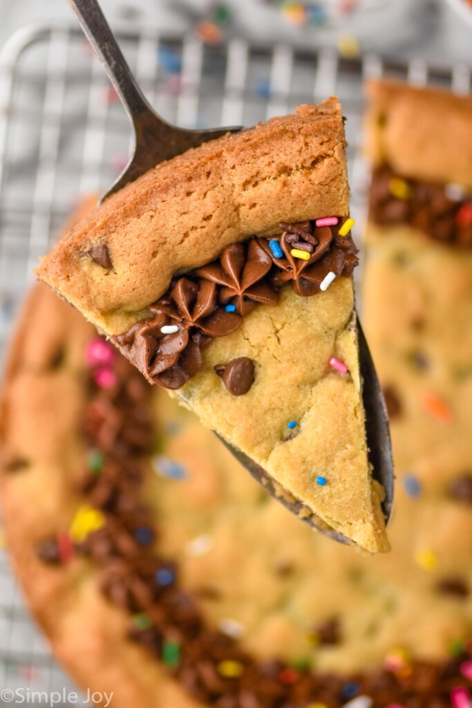 overhead picture of a pice of chocolate chip cookie cake recipe on a spatula