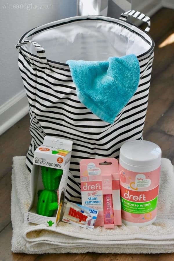A photo of the items that are in the Meijer's give-away: a laundry basket, Cactus Dryer Buddy, a Meijer giftcard, Dreft's Stain Remover, Dreft's Wipes, an towels 
