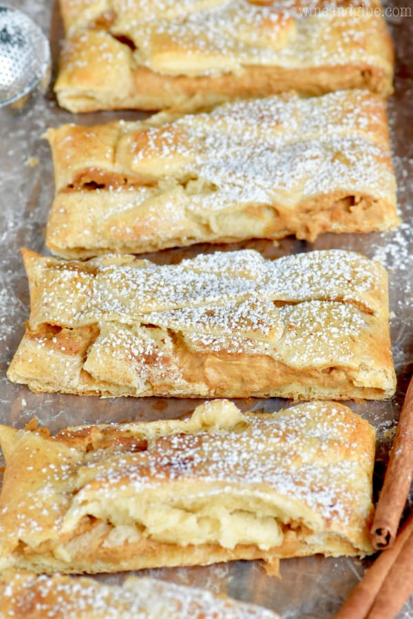 The Pumpkin Cheesecake Braid which are cut into rectangular pieces has a golden crust dusted with powdered sugar. 