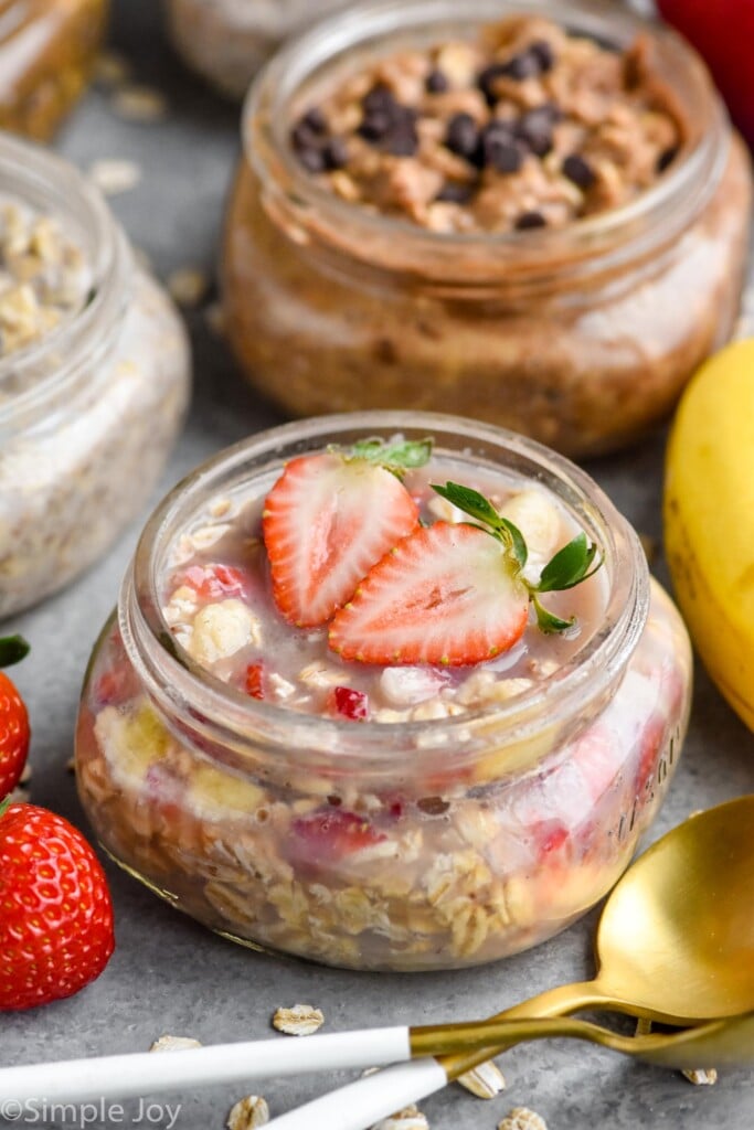 small mason jar filled with strawberry banana overnight oats