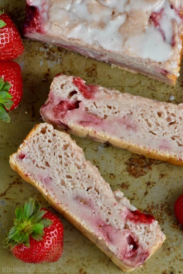 Cut up into little rectangular slices, the Three Ingredient Yogurt Bread has a moist but airy interior with sliced strawberries.