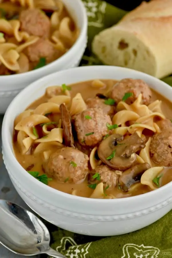 The Meatball Beef Stroganoff are in a white bowl with a slice of bread