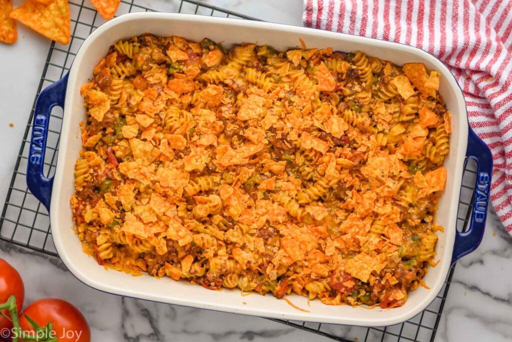 overhead of a baking dish with taco casserole with Doritos