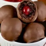 a bowl full of chocolate covered cherry brownie bombs