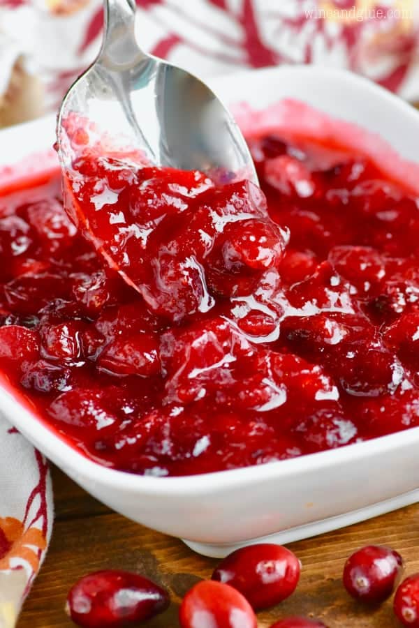 A spoon digging into the Easy Cranberry Sauce 
