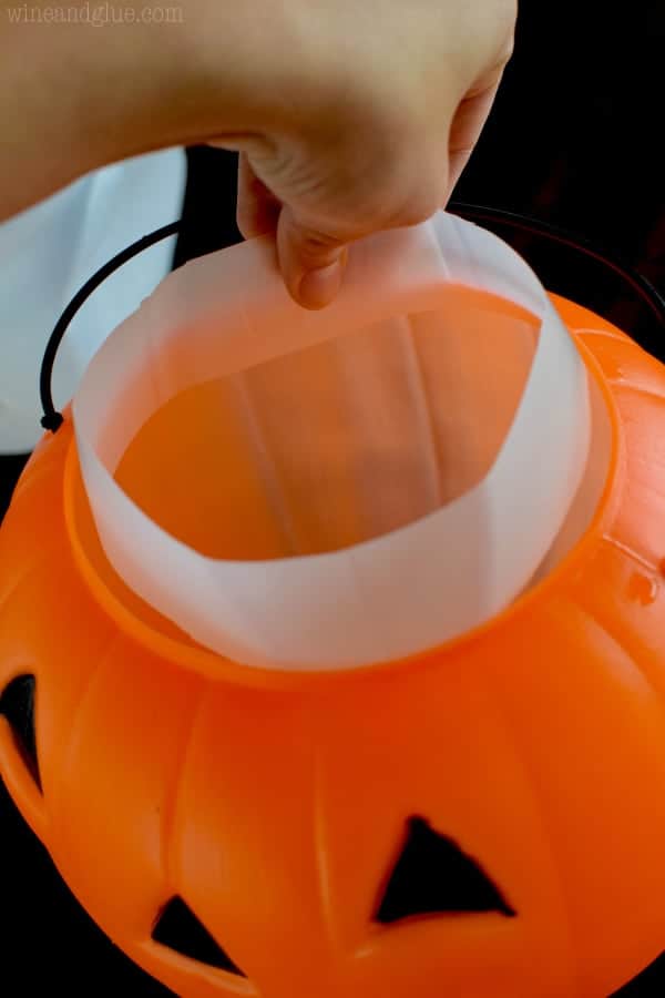 The milk jug band is placed into the Halloween Bucket at the top. 
