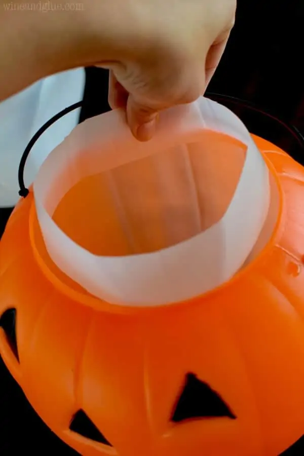 The milk jug band is placed into the Halloween Bucket at the top. 