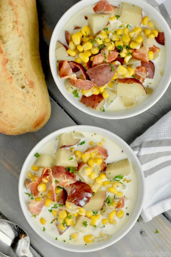 An overhead photo of two bowls of the Bacon Potato Corn Chowder topped with parsley. 
