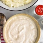 Pinterest graphic for horseradish sauce. Text says "the best horseradish sauce simplejoy.com" Image shows overhead bowl of horseradish