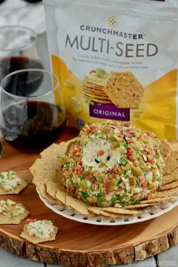 The Olive Cheeseball surrounded by the Multi-Seed Crackers. 