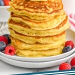 pinterest graphic of stack of six buttermilk pancakes with a pad of butter on top