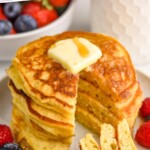 pinterest graphic of overhead stack of best buttermilk pancakes sliced with a bite on a fork