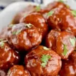 a pile of instant pot cocktail meatballs garnished with parsley