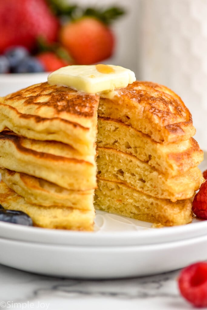stack of buttermilk pancake recipe with a wedge sliced out of the stack