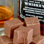 a pile of jack Daniel's fudge in front of a bottle of whiskey