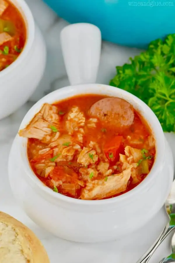 Portions of turkey, sausage, and tomatoes stick out of the Jambalaya Soup. 
