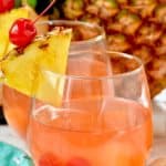 This Pina Colada Rum Punch recipe is made with champagne and takes only five minutes to make! - 6