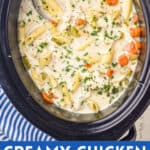 overhead view of a slow cooker full of creamy crockpot chicken noodle soup with the title of the recipe for a pinterest graphic