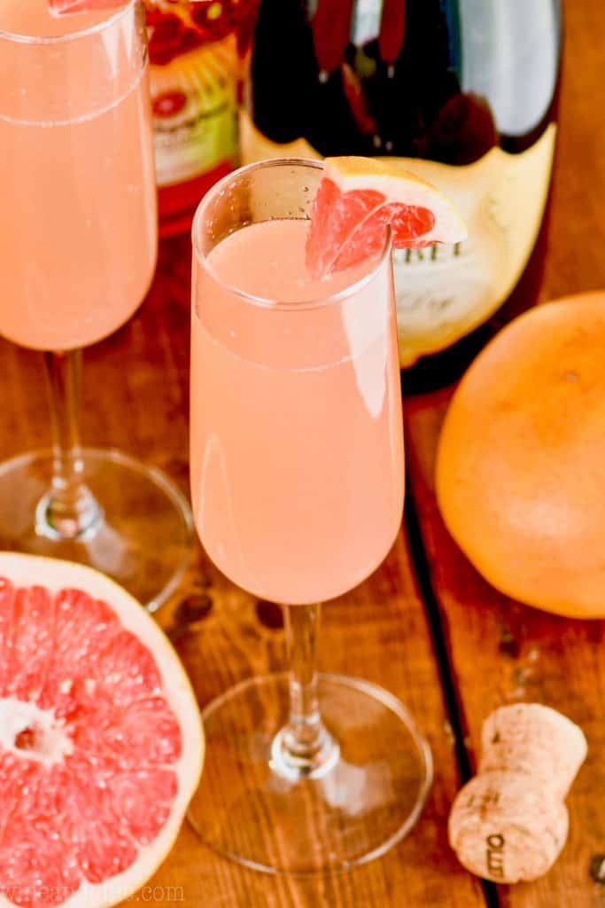 overhead view of a champagne glass filled with pink grapefruit champagne cocktail