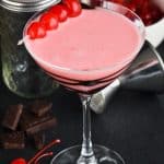 martini glass drizzled with chocolate and full of chocolate covered cherry martini