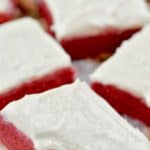 a red velvet cookie bar with a bite missing