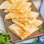 pinterest graphic of triangles of Taco Bell quesadillas on a platter
