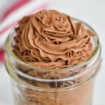 chocolate whipped cream recipe that has been piped into a small mason jar