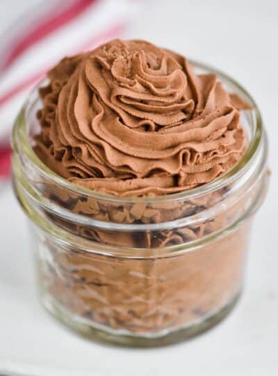 chocolate whipped cream recipe that has been piped into a small mason jar