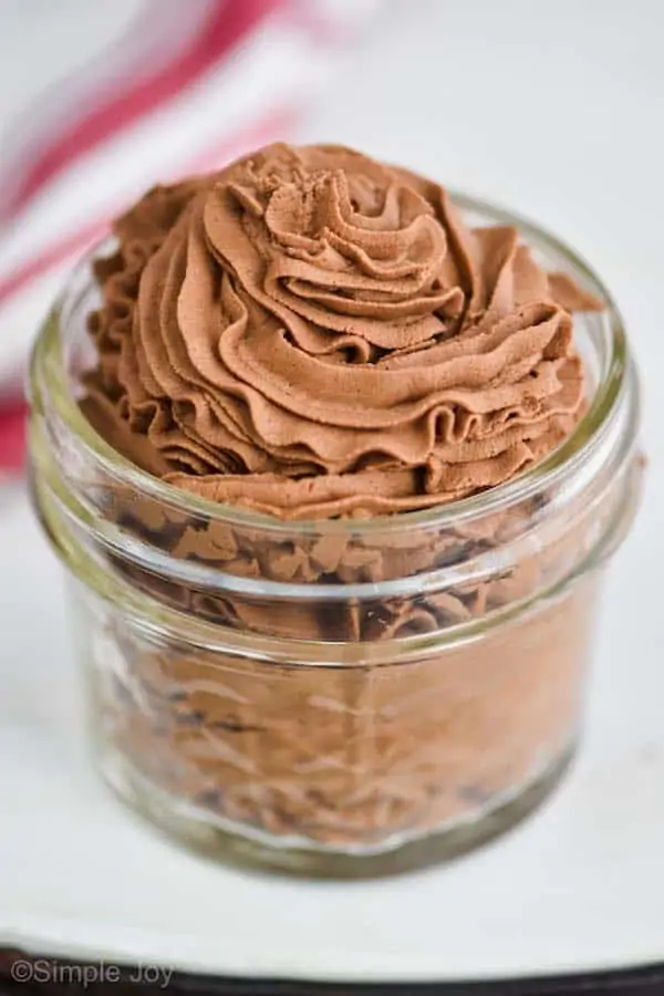 chocolate whipped cream recipe that has been piped into a small mason jar