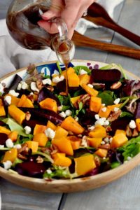 This Roasted Beet Salad recipe with goat cheese and balsamic dressing is the perfect side dish, but it is hearty enough to be a dinner on it's own.