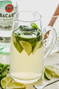 pitcher of mojito sangria recipe with limes and mint