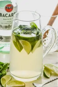 pitcher of mojito sangria recipe with limes and mint