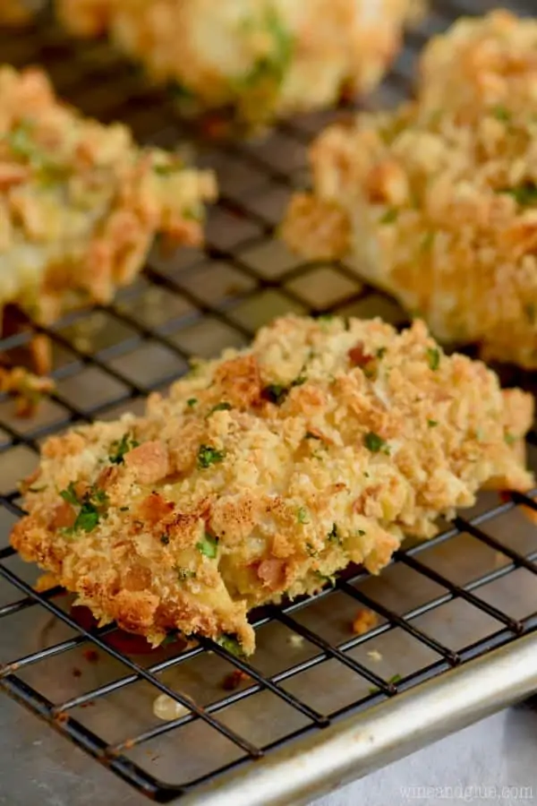 A close up photo of the Oven Fried Fish that is topped with parsley. 