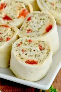 These Pesto Cream Cheese Pinwheels are the perfect appetizer to make. This appetizer recipe comes together quickly, and everything in them goes together so perfectly.