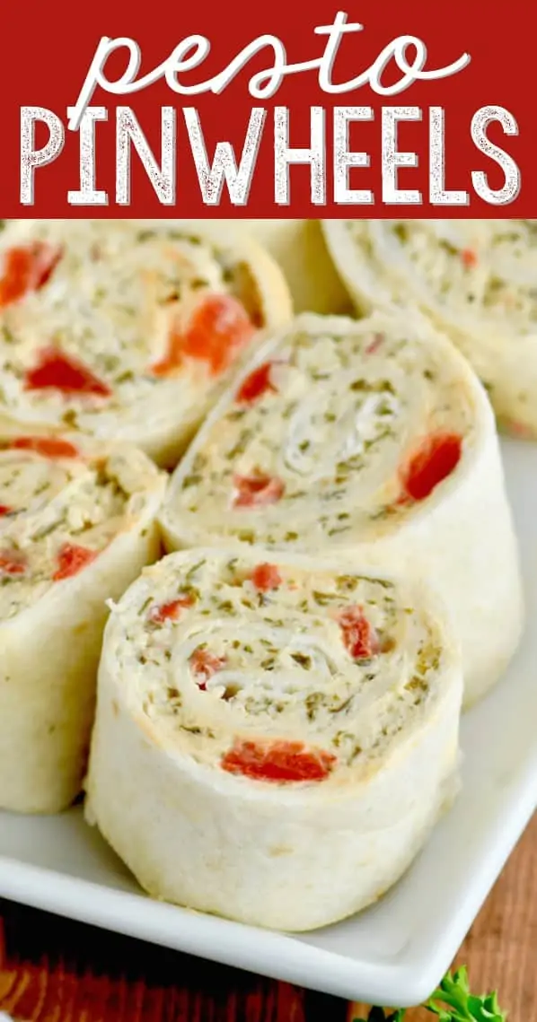 A closeup photo of the Pesto Cream Cheese Pinwheels on a white plate