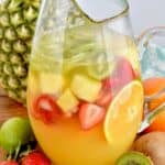 pitcher of tropical margarita sangria filled with fruit