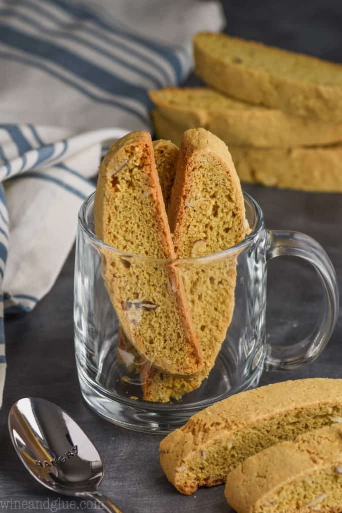 biscotti standing up in a clear coffee mug
