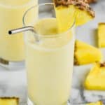 Rum Dole Whip in a glass with pineapple chunks - 9