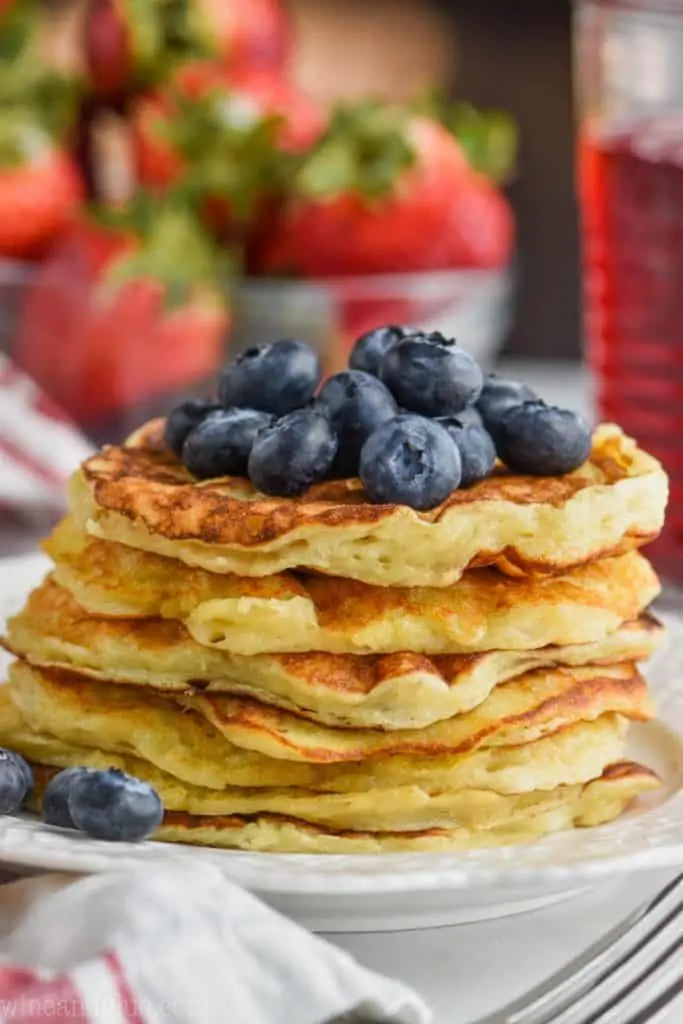 front close view of stack of yogurt pancakes topped with fresh blueberries - 5
