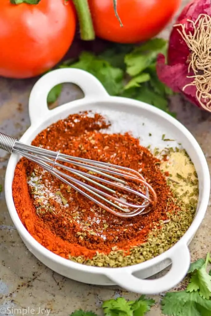 homemade fajita seasoning being mixed together in a small bowl