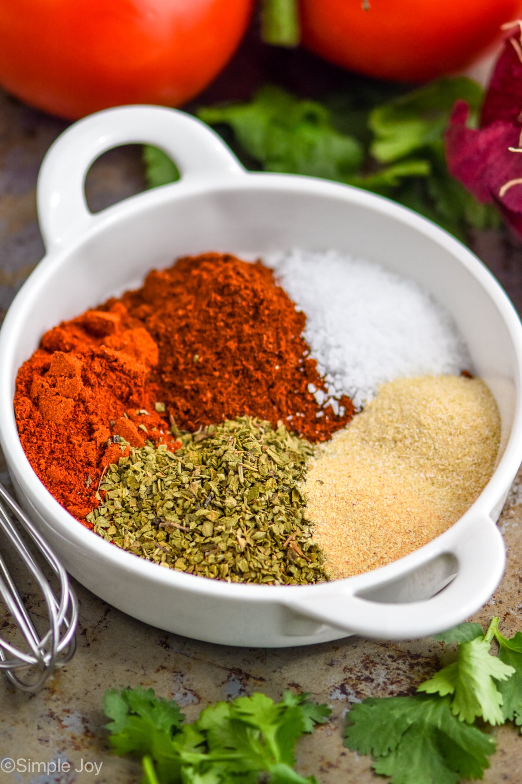 fajita seasoning recipe broken down by ingredient in a small white dish