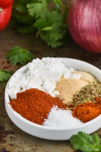 fajita seasoning recipe in a small dish with ingredients separated