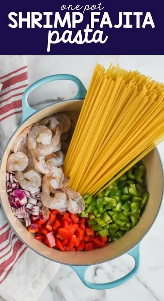 overhead view of one pot pasta with peppers, onions, shrimp, and noodles