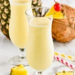 hurricane glass filled with an easy pina colada garnished with a pineapple - 13