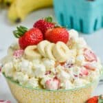 strawberry banana fluff recipe in a bowl with fresh strawberries and bananas