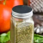 pinterest graphic of small glass jar with metal top full of italian seasoning recipe, says: "the best italian seasoning, simplejoy.com"