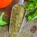 pinterest graphic of small metal scoop full of italian seasoning, says: "the best italian seasoning simplejoy.com"