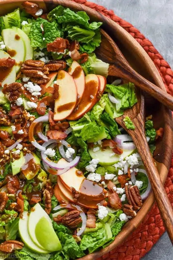 overhead view of apple bacon salad with apples, goat cheese, and pecans