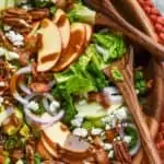 overhead view of apple bacon salad with apples, goat cheese, and pecans